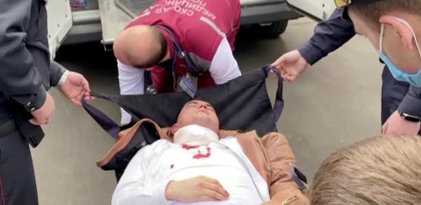 Prisoner trying to cut his neck while listening