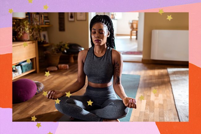 A woman in a gray suit appears, squatting and meditating.