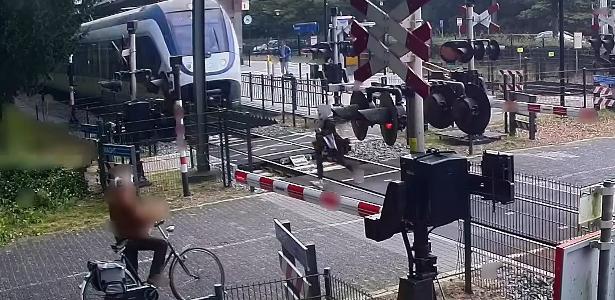 Woman running away from being crushed by train