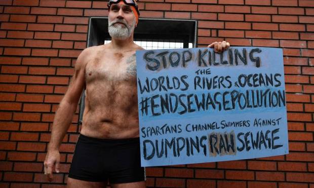 English Channel swimmer protests dumping of raw sewage into the sea in Glasgow during COP26 Photo: BEN STANSALL / AFP