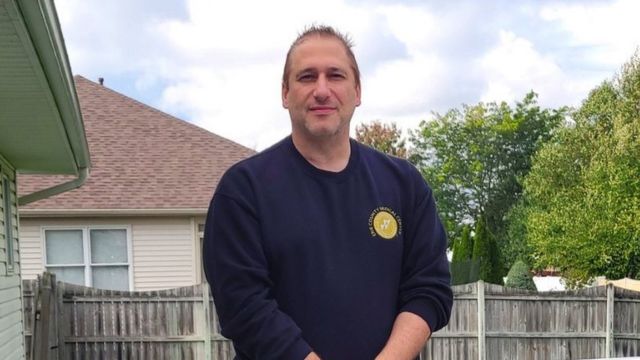 Douglas outside his house