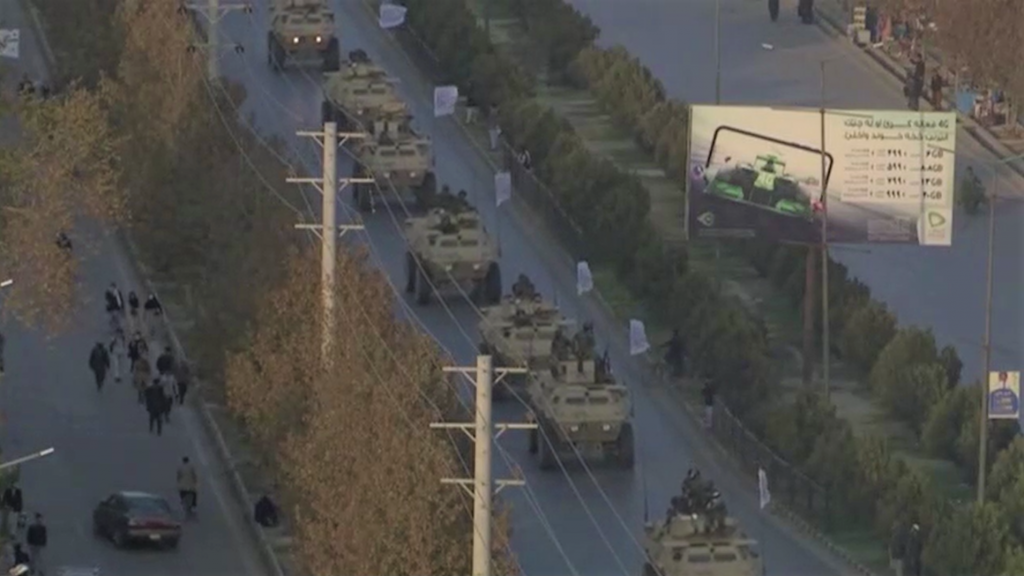 The Taliban marched with US-made weapons to show their strength