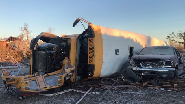 Vehicles damaged by hurricane in Mayfield