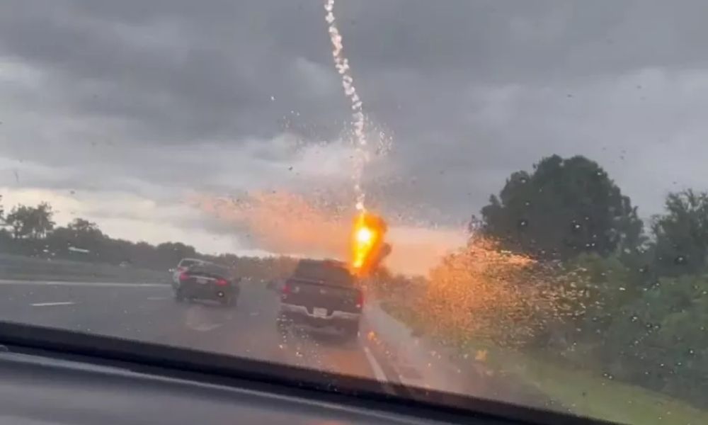 A woman records the exact moment when lightning strikes her husband's car in the United States