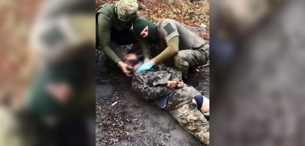 A video clip shows a Russian soldier apparently castrating a Ukrainian prisoner