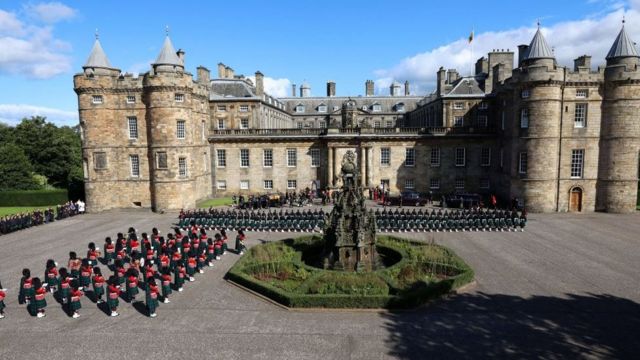 The castle and dozens of people lined the courtyard in distinctive formations as part of the ceremony