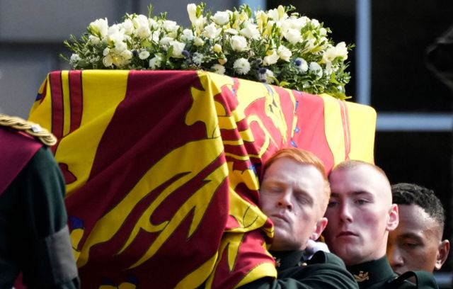 Royal guards carrying the casket