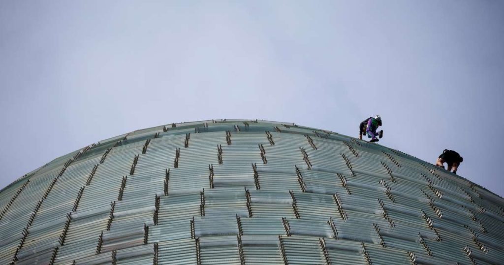 'French Spider-Man' climbs a skyscraper without a belt with his son