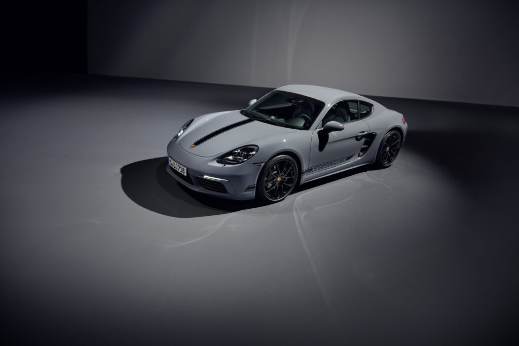White Porsche 718 Cayman Style Edition seen from above, front and studio corner. 
