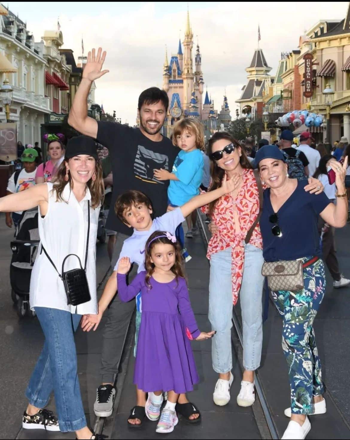 Patricia Abravanal poses with her 3 children and her husband on a trip